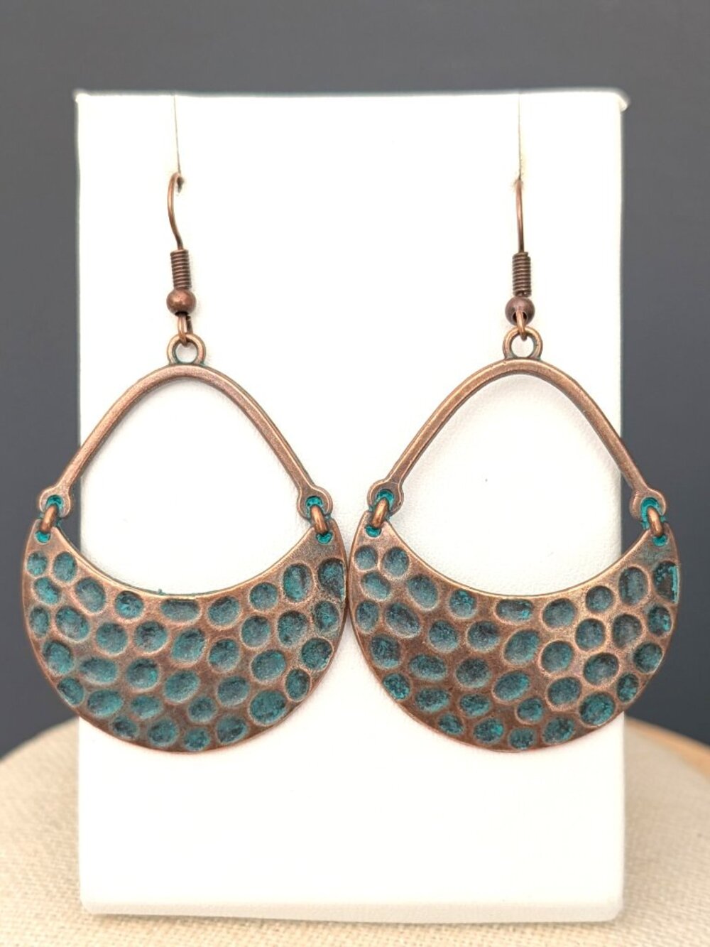 Textured antique brass earrings with patina coating
